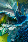 Close-up of Terrarium II, a colorful abstract paper sculpture by Crystal Wagner. Intricately layered and curled paper in blue, green, and white forms a textured, dynamic design reminiscent of foliage or feathers, capturing the vibrant spirit showcased at San Francisco art fairs.