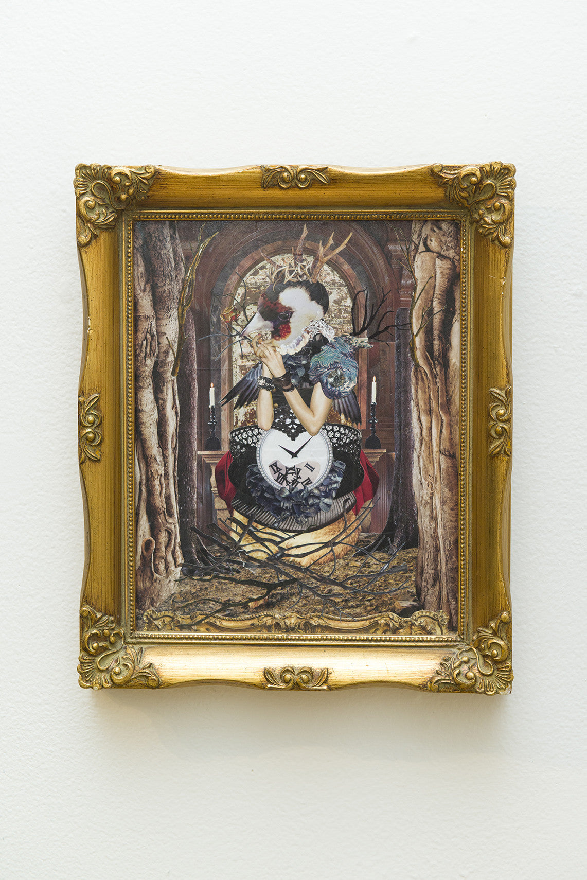 A VAHGE ornate paper collage showcases a surreal figure seated on a throne, holding a heart-shaped object. Adorned with vibrant textures, flowers, and a crown, the artwork features an elegantly detailed background with arches and candles.