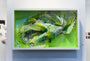 Framed abstract artwork by Crystal Wagner features layered paper cutouts in green, yellow, and white. The 3D swirling effect evokes a terrariums charm, with a bright green background enhancing this vibrant design showcased at Spoke Art.
