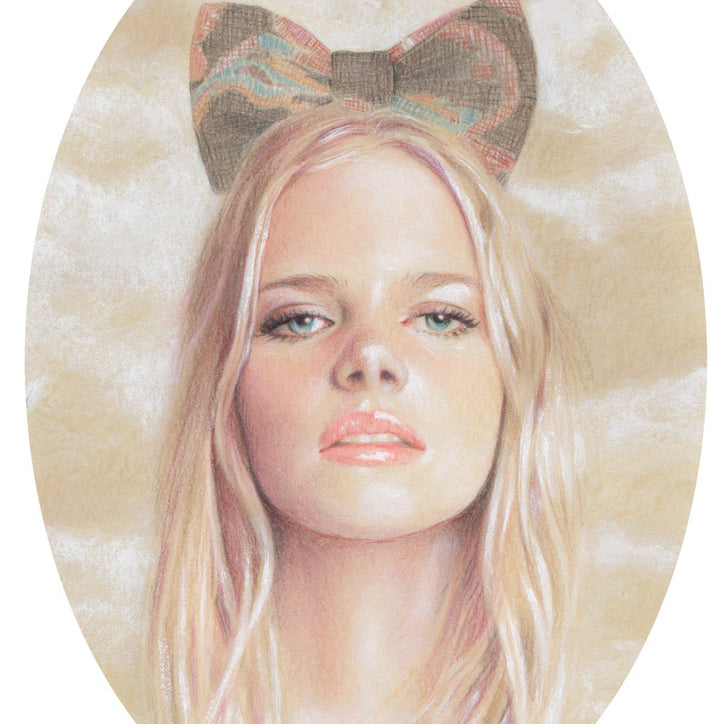 Bec Winnels framed artwork portrays Genevieve with long blonde hair and a large decorative bow. Her serene expression matches the soft, cloud-like background, elegantly enclosed in an oval shape.