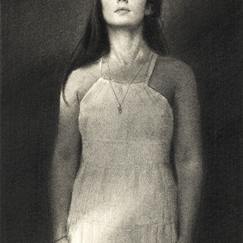 Charcoal drawing by Karla Ortiz: A woman with long hair in a sleeveless dress and necklace stands against a dark background for the La Fae exhibition, eyes slightly upward. Signed in the bottom right corner.