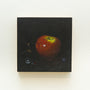 Acrylic on wood panel, this square painting of a red apple against a dark background showcases subtle reflections and abstract elements. A delicate insect adds intrigue, evoking Lilly Piris enchanting style. Displayed artfully on a white wall, its from the brand Lily Piri.