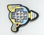 This wall-mounted display by Matt Ritchie features cartoon-style miniature ray guns painted in acrylic on wood. It boasts a vibrant yellow and blue scheme with black outlines, adorned with playful star and zigzag motifs.