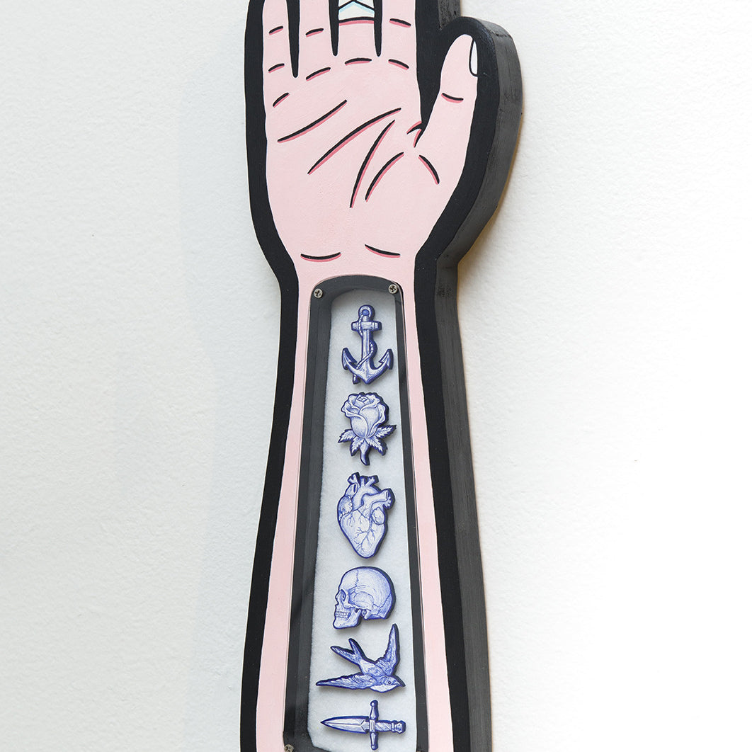 This Matt Ritchie tattoo arm illustration features a bandaged hand with an X-ray forearm design, showcasing an anchor, anatomical heart, skull, and knife. Its bordered in black to highlight the intricate acrylic art details.