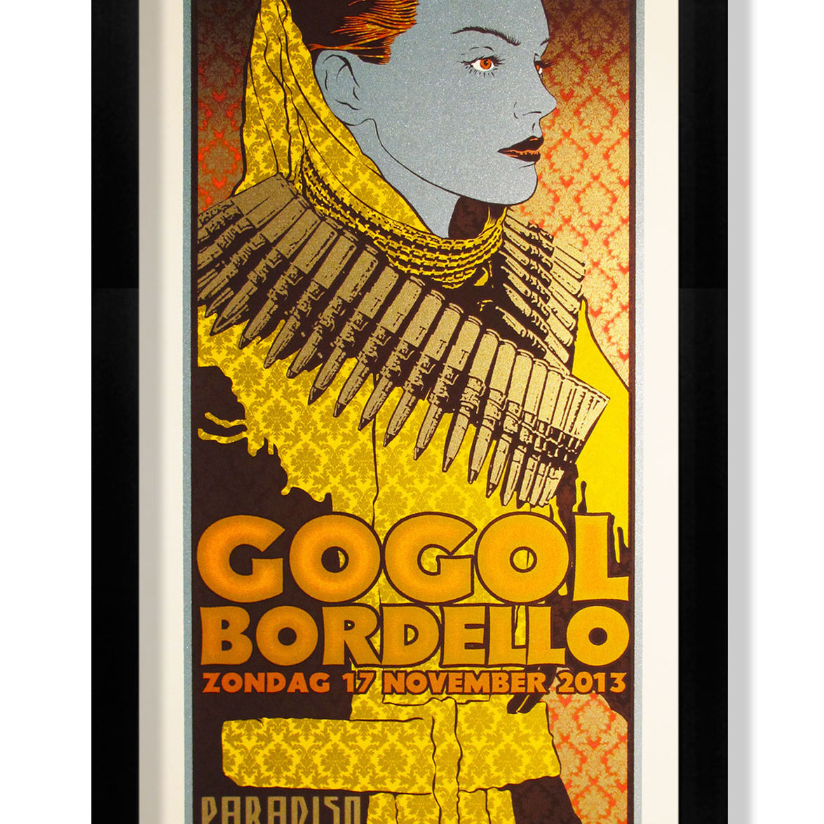 Chuck Sperry-stylized framed poster displays a person in military attire with a bandolier, featuring text: Gogol Bordello, Zondag 17 November 2013, Paradiso Amsterdam, Weteringschans 6-8. Dominated by bold yellow, red, and gray colors.