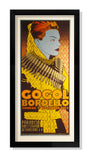Chuck Sperry-stylized framed poster displays a person in military attire with a bandolier, featuring text: Gogol Bordello, Zondag 17 November 2013, Paradiso Amsterdam, Weteringschans 6-8. Dominated by bold yellow, red, and gray colors.