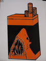 This fine art print features an orange cigarette pack with a shark’s open mouth design at the bottom and three cigarettes protruding from the top, highlighting Shark Toofs iconic style.