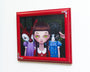 Ana Bagayans oil-on-wood painting features a green-eyed girl with braided hair between a fox in a purple dress and a sheep in blue, evoking trick-or-treaters. Its framed in red with floral decorations.
