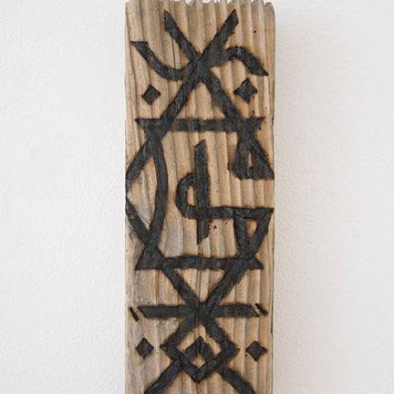 A GATS rectangular wood art piece, showcasing a carved abstract geometric pattern with intersecting lines in dark ink. Its textured surface mimics burnt driftwood and is displayed on a white wall.