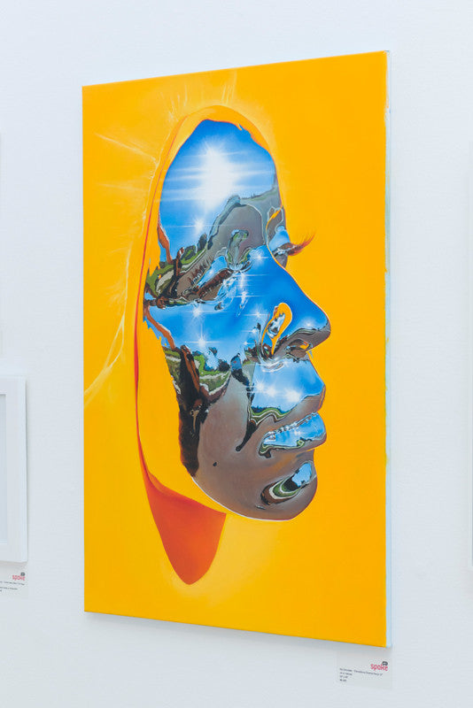 This Kip Omolade masterpiece features a face in profile against a bright yellow background, with reflections of a blue sky and green landscape, seamlessly blending nature and the human form.