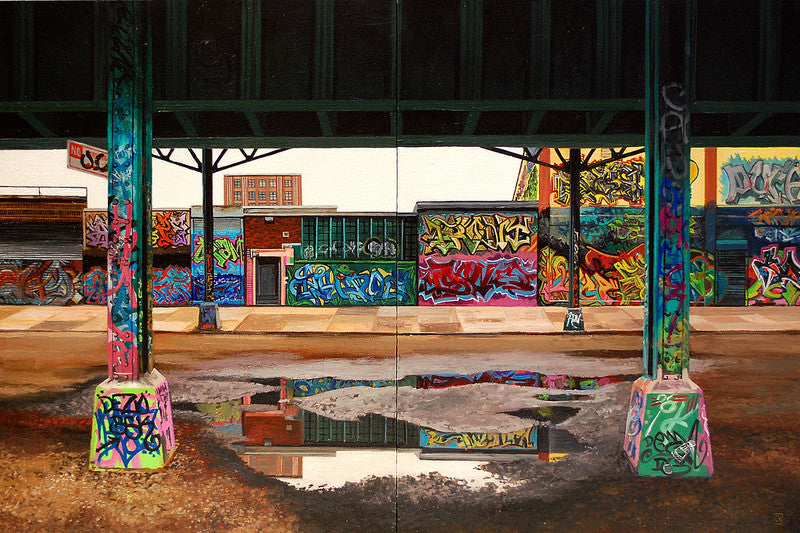 An urban scene by Jessica Hess features a graffiti-covered wall and pillars under an elevated structure, resembling a diptych. A large puddle mirrors the vibrant art. Buildings line Davis Street II under overcast skies, adding to the moody atmosphere.