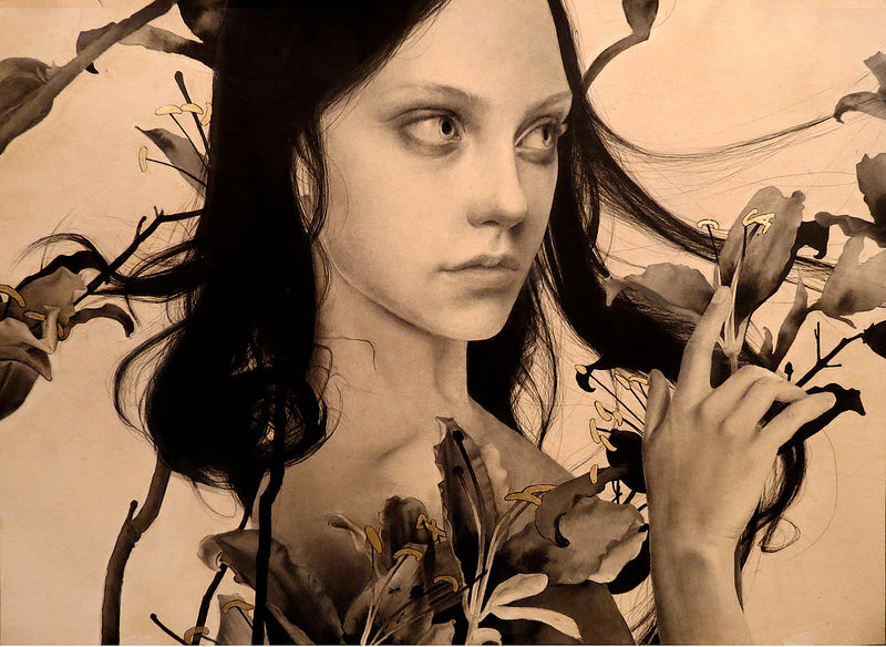 A monochromatic portrait by Alessandra Maria features a young person with dark hair surrounded by lilies, gazing seriously to the side. The composition is enhanced with hints of gold leaf against a light background, creating a striking contrast reminiscent of her style.
