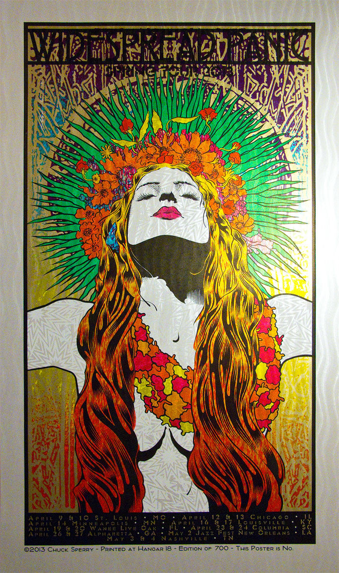The vibrant concert poster by Chuck Sperry shows a woman with long hair, eyes closed, wearing red and orange flowers. She dons a floral necklace and a radiant green-orange crown. Widespread Panic Spring Tour 2013 is displayed at the top.