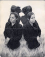 A graphite sketch by Albert Ramos shows a woman with closed eyes, mirrored thrice like Janus, in tall grass. Her hair is in a bun, she wears a coat, and holds threads delicately. The artwork looks as if rendered on well-worn Moleskine pages.