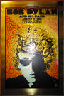 Bob Dylan and his band concert poster designed by Chuck Sperry, featuring a stylized portrait with swirling patterns in bold colors. This Brushed Gold Foil Edition commemorates the August 25, 2010 show at The Warfield, San Francisco.