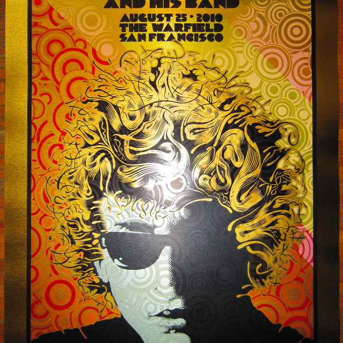 Bob Dylan and his band concert poster designed by Chuck Sperry, featuring a stylized portrait with swirling patterns in bold colors. This Brushed Gold Foil Edition commemorates the August 25, 2010 show at The Warfield, San Francisco.