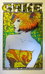 A vibrant Chuck Sperry poster showcases a woman with orange and yellow hair in a colorful strapless dress, set against an intricately designed green background on archival cream paper. It features the text Chuck Sperry Cake, referencing the 2013 event at Santa Cruz Civic Auditorium.