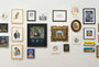 A gallery wall showcases cat-themed artworks, including Heiko Windisch pieces, featuring portraits, whimsical scenes, and creative interpretations of cats through paintings, drawings, and digital art in various styles and frames.