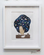 This Soey Milk original painting depicts a cat seated upright in a space helmet, reminiscent of the Lil Bub art exhibit, against a starry night sky filled with planets. A tiny shell beside it adds charm to the otherworldly scene.
