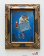 The Lil Bubs Moonlight Ride artwork by Isabel Samaras depicts a cat in a white blanket in a bicycle basket, ridden by a child in a red hoodie. The ornate wooden frame complements the night sky scene with blue and trees; its charmingly reminiscent of Samaras original style.