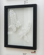 A framed art piece by Elaine Penwell showcases two intricately hand-cut paper birds titled Flight Call, facing each other with wings spread wide, set against a plain background within a sleek black frame.