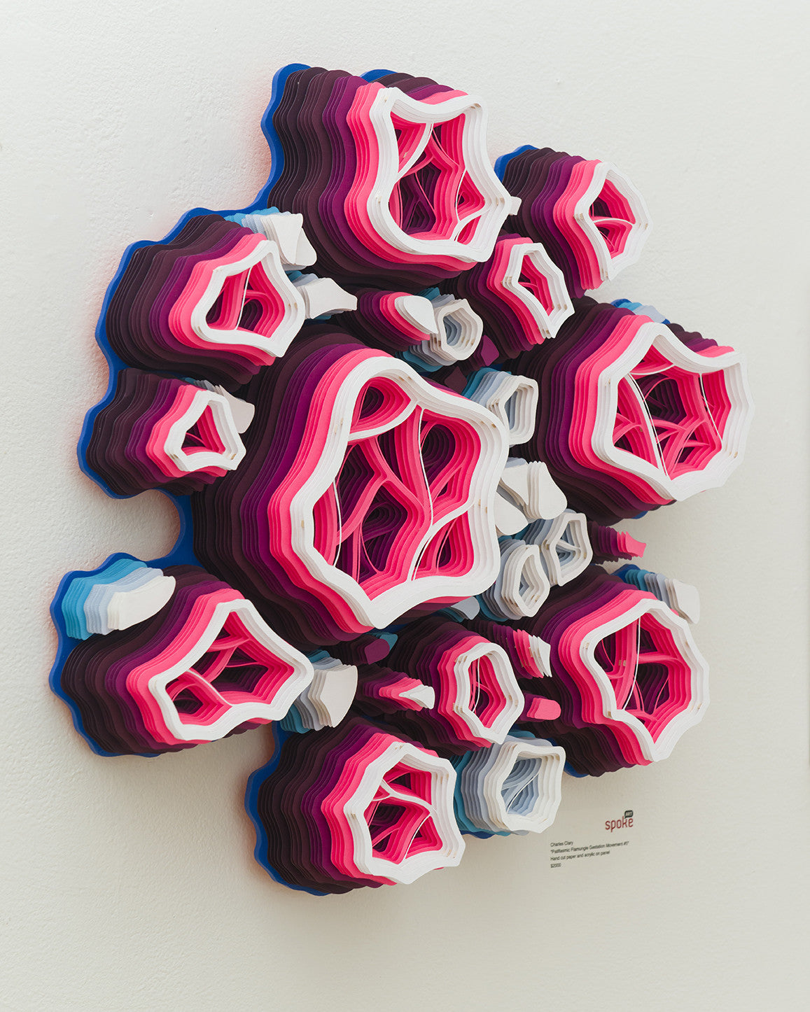 This vibrant 3D paper sculpture by Charles Clary features hand-cut layers in pink, purple, blue, and white, resembling organic wall growths. The complex structure with hollow web-like interiors echoes acrylic on panel art.