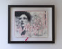 A Craww artwork in a frame features a mixed media sketchbook piece. The left page displays a graphite portrait of a woman, while the right shows detailed red and black ink floral sketches, creating an ethereal vibe with its veiled elements.