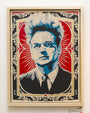 A stylized portrait with spiky hair by Epyon5 features blue tones against a red and black ornate background, made with hand-cut stencils. The intense expression and vintage poster aesthetic seamlessly blend with hints of Chinese newsprint.
