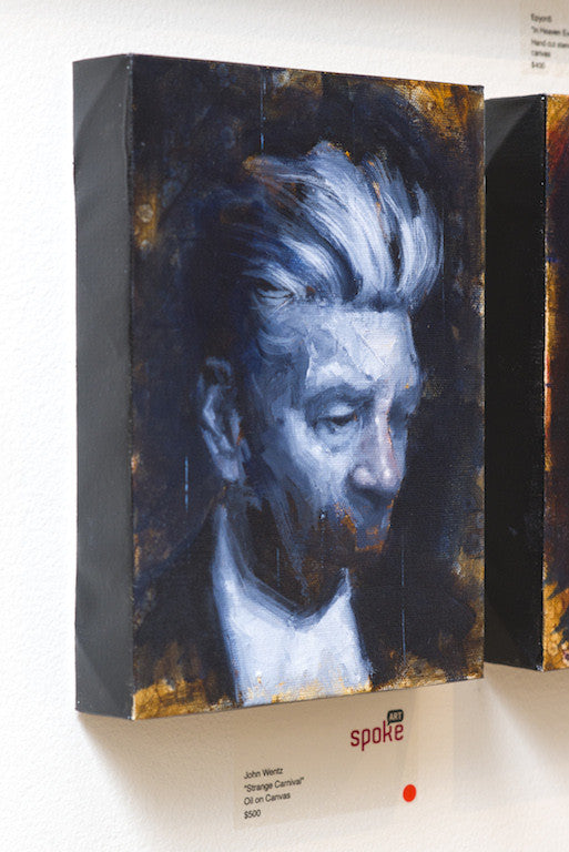 An oil on canvas by John Wentz, this framed portrait features a person with white hair against a dark, textured background, displayed on a gallery wall with a label beneath it.