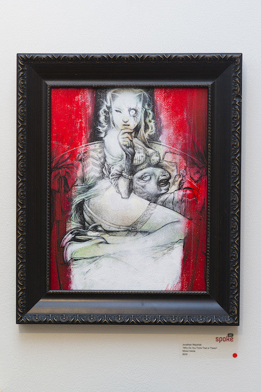 Framed art by Jon Wayshak features a surreal scene with a child-like figure holding an animal, set against a vibrant red background. This mixed media piece blends abstract and realistic elements, offering a dreamlike atmosphere ideal for art lovers and collectors.