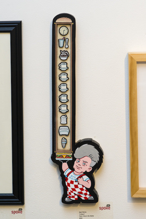 Matt Ritchies mixed media artwork shows a cartoon in a checkerboard outfit pushing a stacked food chart with icons like a clock and ice cream; this framed piece looks stunning on the wall.