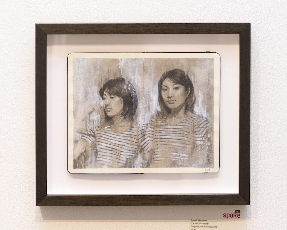 Lauren in Stripes is a framed artwork by Patrick Mathews, featuring two similar portraits of a woman in a striped shirt. The textured grayscale background enhances the graphite ink and gouache details, with Mathews signature in the bottom right.