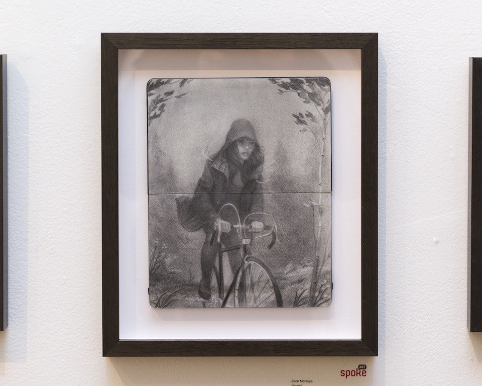 A graphite sketch by Zach Montoya features a person in a hooded jacket cycling. The black and white art, reminiscent of Moleskine sketches, is divided into two pieces displayed together on a light background.
