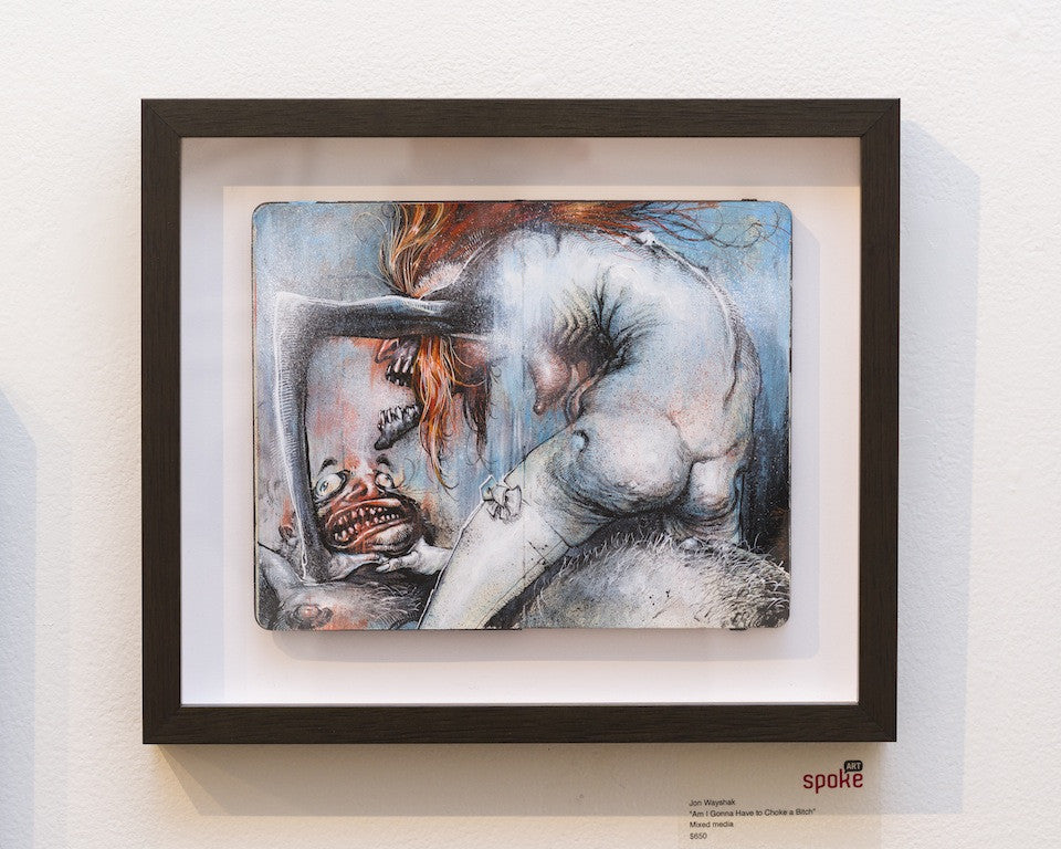 The framed artwork by Jon Wayshak features a surreal figure with vibrant orange hair bending over a grotesque face, both with exaggerated features. Crafted in mixed media, it uses muted colors and abstract elements. Its labeled as art for sale at the gallery.
