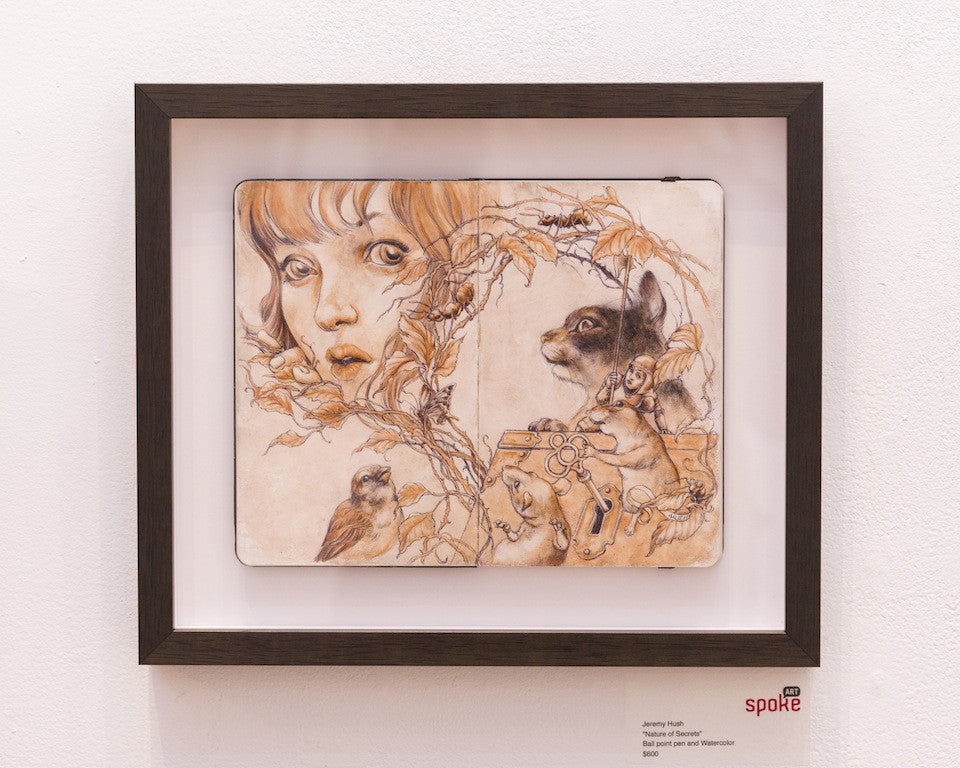 Jeremy Hushs artwork depicts a young girls face amidst autumn leaves and branches, with a cat-like creature and bird to the right, capturing The Nature of Secrets. It resembles ballpoint pen sketches in sepia tones and is elegantly displayed in a black frame.