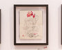 A sketch-style framed artwork by J.A.W. Cooper depicts a fantasy scene with a nude humanoid figure with animal features surrounded by a wolf, rat, and cat, holding a red geometric gem-like object.
