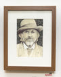 Framed artwork by Alex R. Kirzhner, featuring a bearded man in a hat and suit amid detailed foliage, reminiscent of King Schultz art. Its set in a wooden frame with the Art Spoke logo at the bottom.