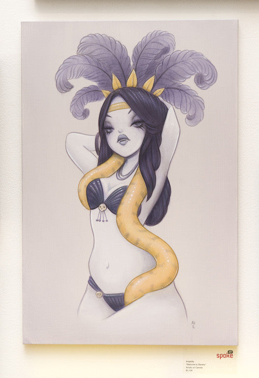 Anarkittys illustration features a woman with long dark hair, wearing a feathered headpiece and two-piece outfit. A yellow snake elegantly drapes around her neck, highlighted by the artists signature style. Set against a minimal backdrop, this captivating piece evokes the vividness of acrylic on canvas.