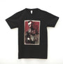 Unisex black T-shirt by Grzegorz Domaradzki featuring a Taxi Driver-inspired graphic of a man in sunglasses with vibrant red, black, and white tones, text scribbles, and images of two other figures. Made from 100% cotton with a plain white background.