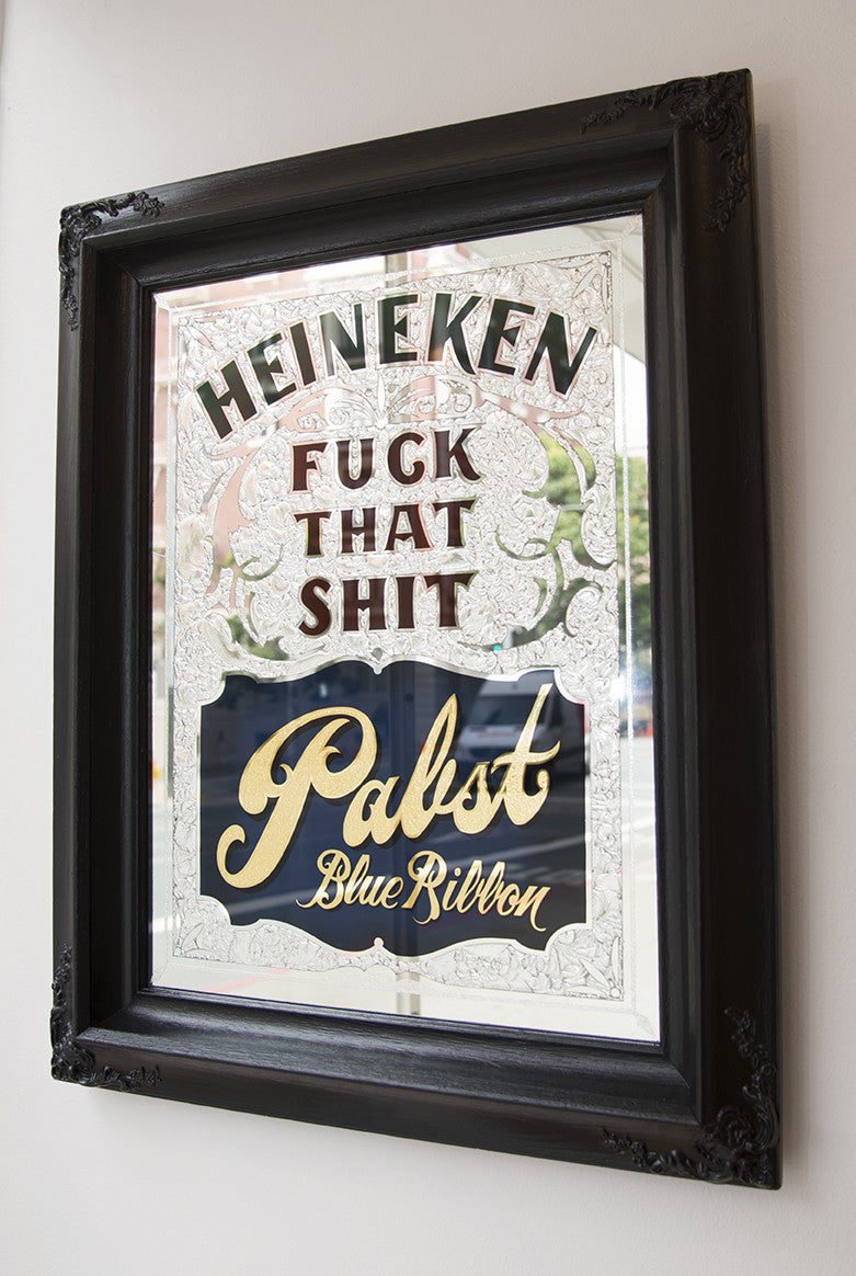 A framed mirror sign featuring decorative elements and mixed media artistry boldly displays: Ken Davis, Fuck That Shit, Pabst Blue Ribbon.