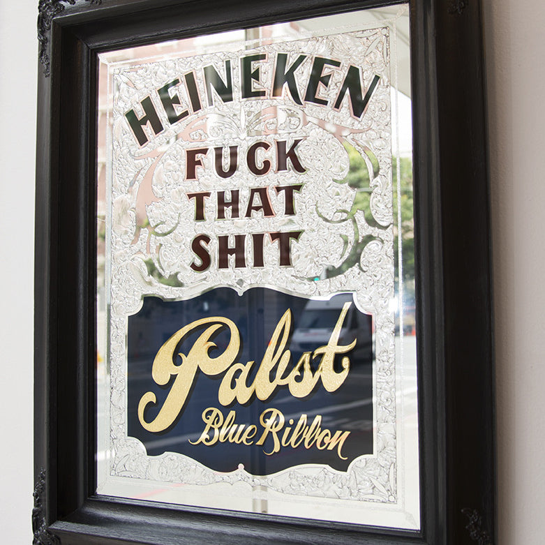 A framed mirror sign featuring decorative elements and mixed media artistry boldly displays: Ken Davis, Fuck That Shit, Pabst Blue Ribbon.