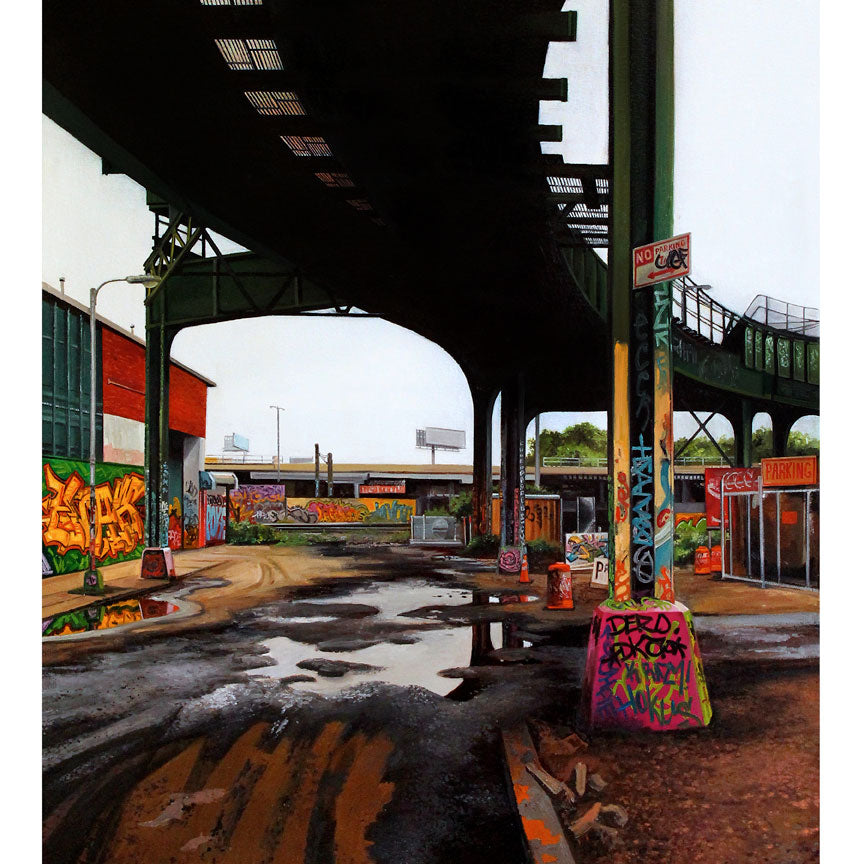An urban scene unfolds under an elevated railway with graffiti-covered walls and pillars, industrial and red-brick buildings framing the view. Puddles reflect the tracks above, while the overcast sky adds to a moody atmosphere reminiscent of a Jessica Hess fine art giclee.