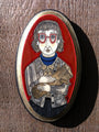 Evan Harris presents a mixed media illustration of the Log Lady: gray hair, red glasses, checkered jacket, blue turtleneck, holding logs. It features a textured hand-painted design with a vibrant red background and gold border.