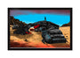 This limited edition print by Tim Doyle depicts a stunning desert scene from the UnReal Estate series. A lone figure with a weapon stands atop a metallic wrecked vehicle; red flags contrast against the vibrant blue sky, enhancing the sandy landscapes vividness.