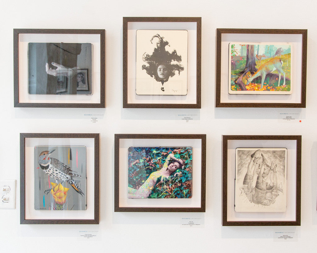 A two-by-three grid of six framed artworks by Frank Gonzales displays diverse styles, including abstract, portrait, and nature themes like the vibrant Opuntia Bloom cactus. The wooden frames enhance the art against a crisp white backdrop.