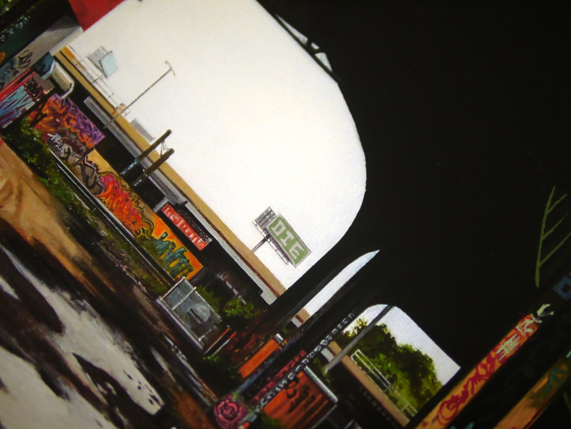 Urban scene under a bridge with graffiti-covered columns and walls, captured using Jessica Hesss artistic touch. A highway with a visible Lidl sign looms in the background, while the foreground dances in dark shadows and patches of light.