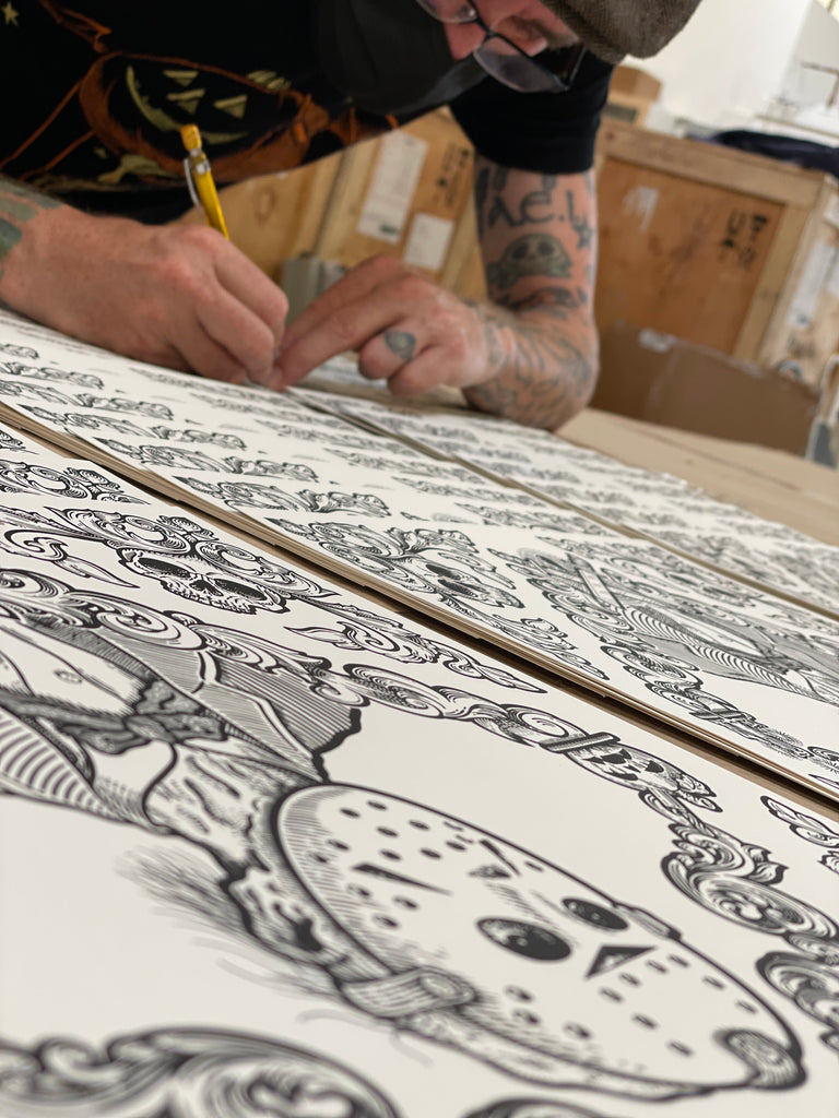Matt Ritchie signing and numbering his Horror Toile Jason screenprints