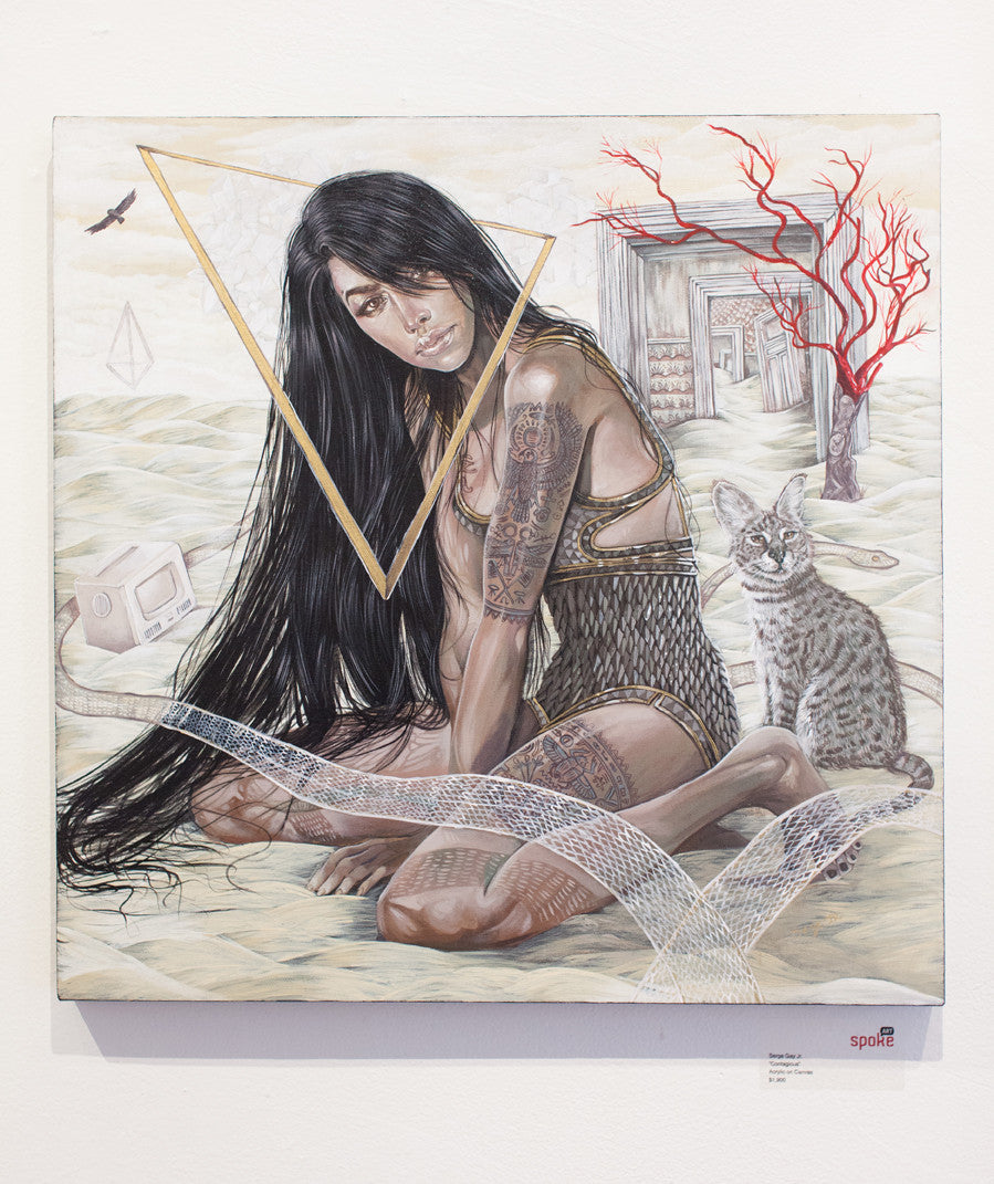 A surreal Serge Gay Jr. painting in acrylic on canvas depicts a woman with long dark hair in patterned clothing on a sandy surface, framed by a golden triangle. A cat joins her amid a vintage TV, red branches, and rustic structures.