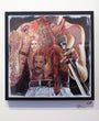 A vibrant Serge Gay Jr. painting depicts Freddie Mercury with a microphone and red tie, surrounded by smaller images of him. This captivating artwork is elegantly framed and displayed on a white wall.