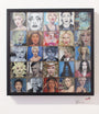 A striking framed artwork by Serge Gay Jr. features a grid of 25 portraits, each showcasing a unique expression or style of a blonde-haired woman. The vibrant collection varies in color and mood, reflecting his renowned Video Pop flair.